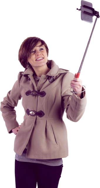 Smiling Woman with Short Hair Using Selfie Stick Wearing Transparent Beige Coat - Download Free Stock Videos Pikwizard.com