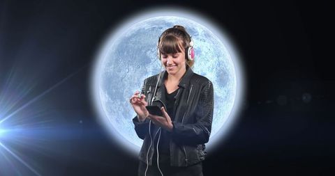 Smiling Woman with Headphones in Front of Illuminated Planet