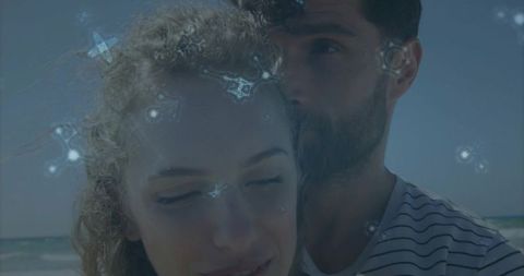 Embracing Couple with Constellation Overlay at Seaside
