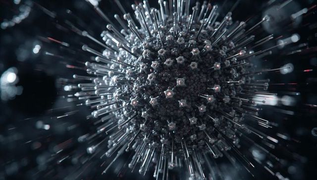 Rotating glassy nanoparticle with hexagonal nodules and spiky glowing rods