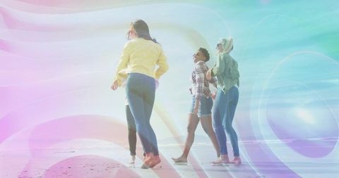 Walking barefoot friends on pastel shoreline with dreamy light trails
