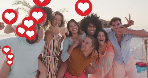 Smiling Friends Taking Beach Selfie with Social Media Hearts