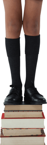 Transparent Overlay of Student Standing on Books for Education Concept