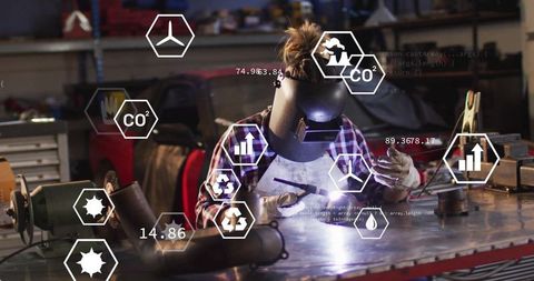 Female Welder Innovating Sustainable Workbench Sparks CO2 Emission Technology Concepts