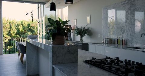 Sunlit Modern Kitchen with Marble Island and Luxury Elements