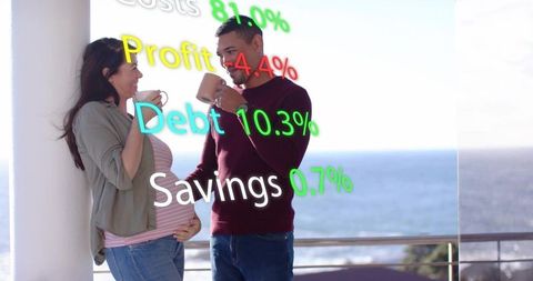 Expectant couple enjoying coffee on coastal balcony with financial ar overlays
