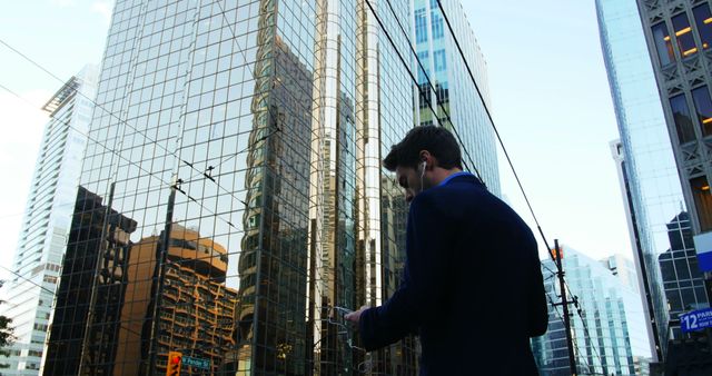 Businessman Listening to Music in Modern Cityscape Background - Download Free Stock Images Pikwizard.com