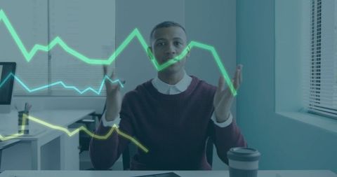 Young professional analyzing holographic charts in office