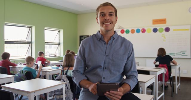 Smiling Teacher in a Classroom with Students Engaged in Learning - Download Free Stock Images Pikwizard.com