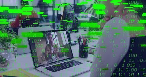 Remote collaboration on laptop with video call in open-plan office and binary code overlay