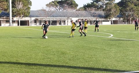 Youth Soccer Practice on Sunny Day with Team Strategy