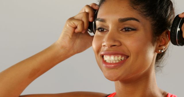 Smiling Woman Wearing Headphones Indoors - Download Free Stock Images Pikwizard.com