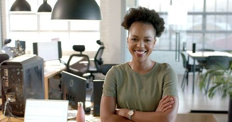 Confident Female Entrepreneur Smiling in Modern Office Environment - Download Free Stock Images Pikwizard.com