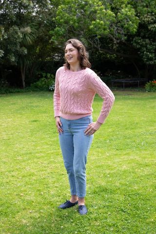Woman enjoying peaceful moment in lush backyard garden