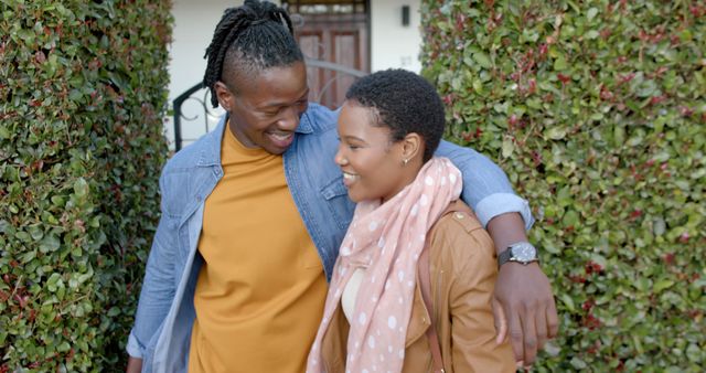 Happy african american couple embracing outside a house - Download Free Stock Photos Pikwizard.com