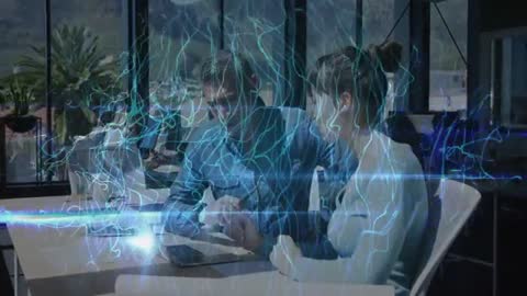 Coworkers Collaborating on Tablet Under Futuristic Network Graphic