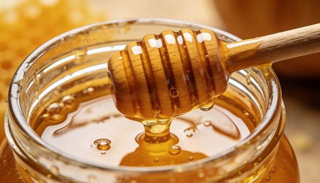 Dripping Honey Jar with Wooden Dipper, Glowing Amber Nectar Macro Closeup