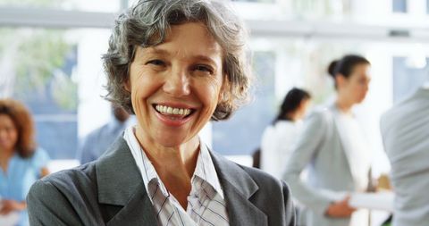Smiling Mature Businesswoman in Office Environment - Download Free Stock Images Pikwizard.com
