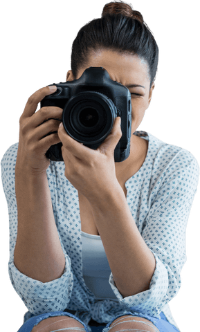 Young female photographer with transparent background holding camera