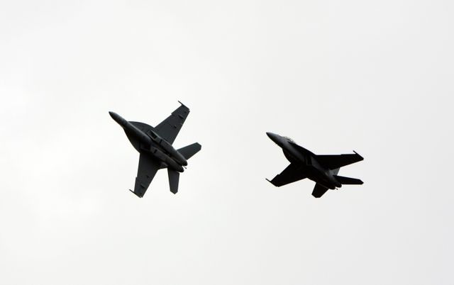Two F/A-18 Jets Performing Flyover at Kennedy Space Center - Download Free Stock Photos Pikwizard.com