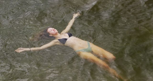Woman Floating in Natural Water Relaxing and Enjoying Swimming - Download Free Stock Images Pikwizard.com