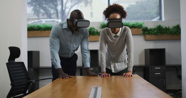 Colleagues Wearing VR Headsets Collaborating in Modern Office - Download Free Stock Images Pikwizard.com