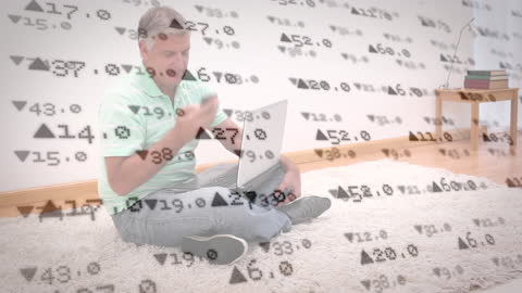Man Using Laptop amidst Digital Financial Data Overlays
