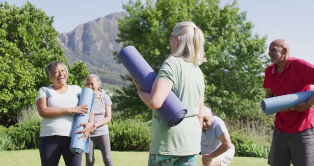 Seniors Engaging in Outdoor Yoga Class Holding Mats Laughing - Download Free Stock Images Pikwizard.com