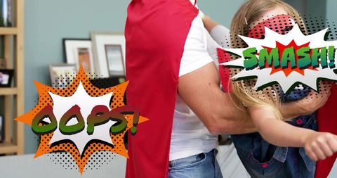 Father holding daughter flying in room wearing red cape superhero playing oops smash