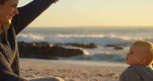 Mother and Baby Playing on Beach During Sunset - Download Free Stock Images Pikwizard.com