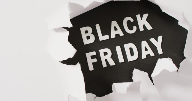 Text within torn white paper background, ideal for marketing Black Friday sales and promotions. Suitable for use in advertisements, social media posts, email marketing, and website banners to highlight discounts and special offers for Black Friday.