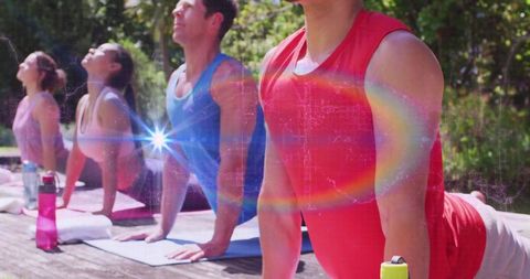 Group Yoga Session Outdoors with Vibrant Analogue Effects