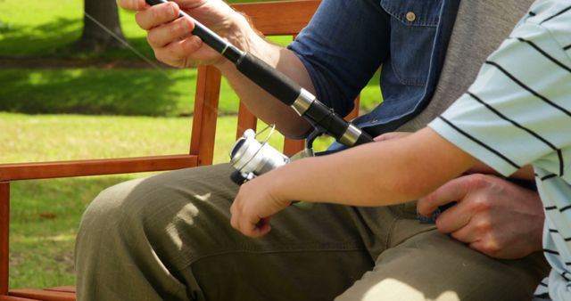 Father and Son Bonding While Fishing Together in Park - Download Free Stock Images Pikwizard.com