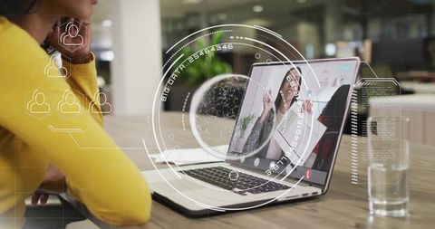 Businesswoman joining virtual meeting in modern office workspace