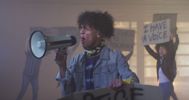 Young Activist Protesting with Megaphone at Rally - Download Free Stock Images Pikwizard.com