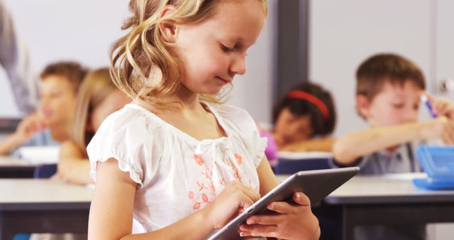 Young Girl Using Tablet in Classroom - Download Free Stock Photos Pikwizard.com