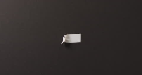 White Paper Fragment on Dark Background