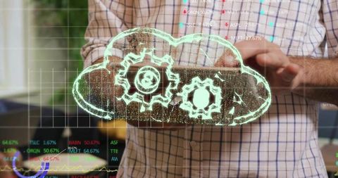 Businessman tapping tablet generating holographic cloud with gears and financial charts