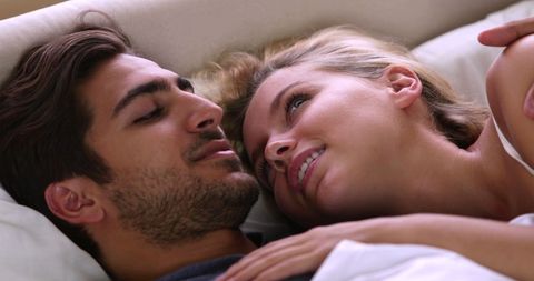 Romantic Couple Enjoying Intimate Moment in Cozy Bedroom