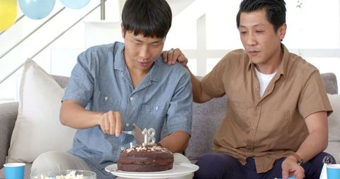 Joyful Birthday Celebration with Friends Sharing Cake and Popcorn