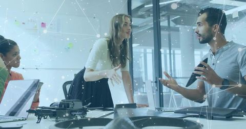 Diverse Professionals Engaging in Productive Drone Project Meeting