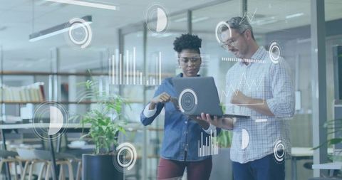 Professionals Analyzing Digital Holograms in Modern Office