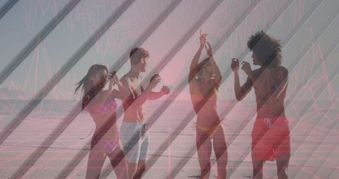 Vibrant beach party with friends dancing in swimwear