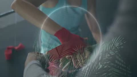 Coach Wrapping Boxer Hand with Red Wrap During Intense Gym Training Close-Up