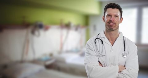 Confident Male Doctor Standing in Hospital Room