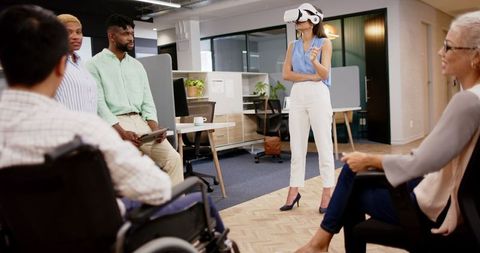 Woman Leading Innovative Team Meeting with VR Headset in Modern Office