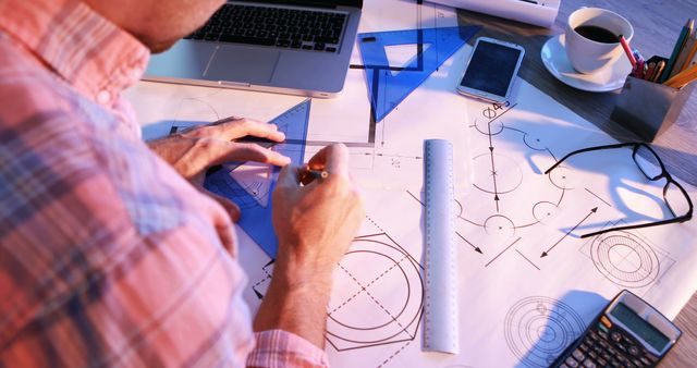 Engineer Working on Technical Drawings at Desk - Download Free Stock Images Pikwizard.com