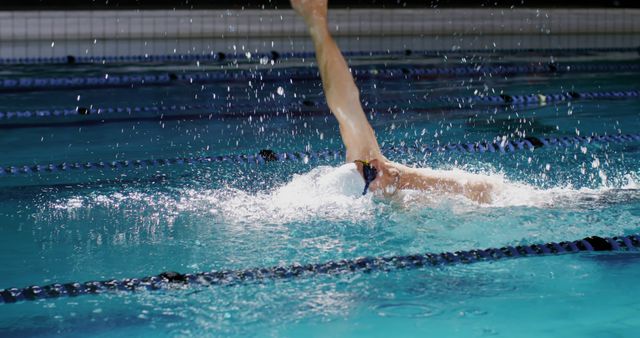 Competitive Swimmer Performing Backstroke Stroke in Swimming Pool - Download Free Stock Images Pikwizard.com