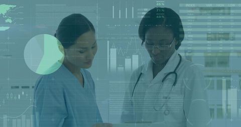 Healthcare professionals analyzing data with digital technology in clinic