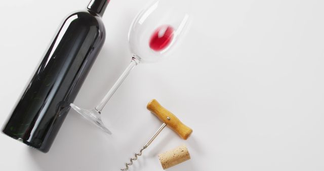 Image features a wine bottle, an empty wine glass, a corkscrew, and a cork on white background. Ideal for use in advertisements for wine products, blog posts about wine-tasting events, or social media promotions for wineries. Also suitable for illustrating lifestyle articles that focus on relaxation or social gatherings.